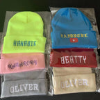 Navy blue custom knit beanie with embroidered logo