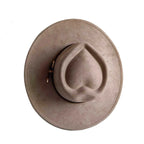 Beige heart-shaped suede hat – unique fashion hat worn by model