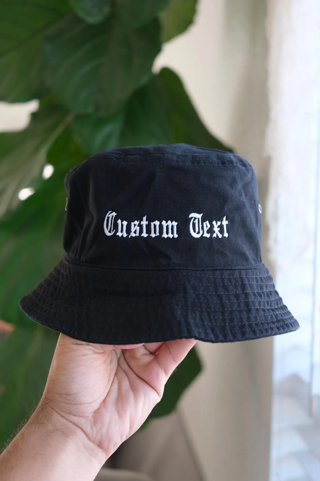 Beige bucket hat with embroidered custom logo