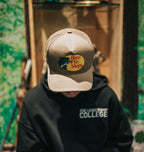 Close-up of a printed logo on a flat-brim snapback cap
